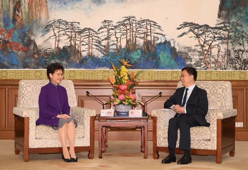 The Chief Executive, Mrs Carrie Lam (left), is received by the Vice Premier of the State Council, Mr Han Zheng (right), in Beijing this morning (November 6).