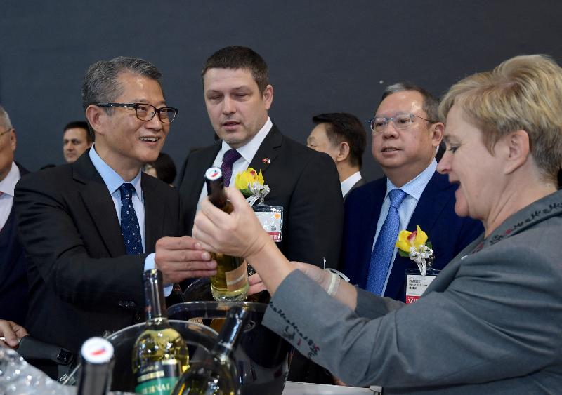 The Financial Secretary, Mr Paul Chan (first left), tours the Hong Kong International Wine & Spirits Fair 2019 at the Hong Kong Convention and Exhibition Centre today (November 7).