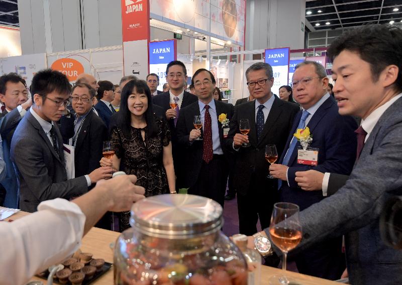 The Financial Secretary, Mr Paul Chan (third right), tours the Hong Kong International Wine & Spirits Fair 2019 at the Hong Kong Convention and Exhibition Centre today (November 7).