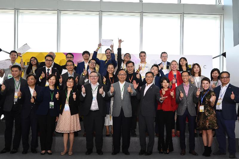 The Secretary for Innovation and Technology, Mr Nicholas W Yang (front row, centre); the Chief Executive Officer of the Hong Kong Science and Technology Parks Corporation, Mr Albert Wong (front row, fifth right); the Director-General of Investment Promotion, Mr Stephen Phillips (front row, fifth left); the Commissioner for Innovation and Technology, Ms Rebecca Pun (front row, fourth left), join the top 10 finalists, partners and sponsors for a group photo at the Elevator Pitch Competition 2019 today (November 8).