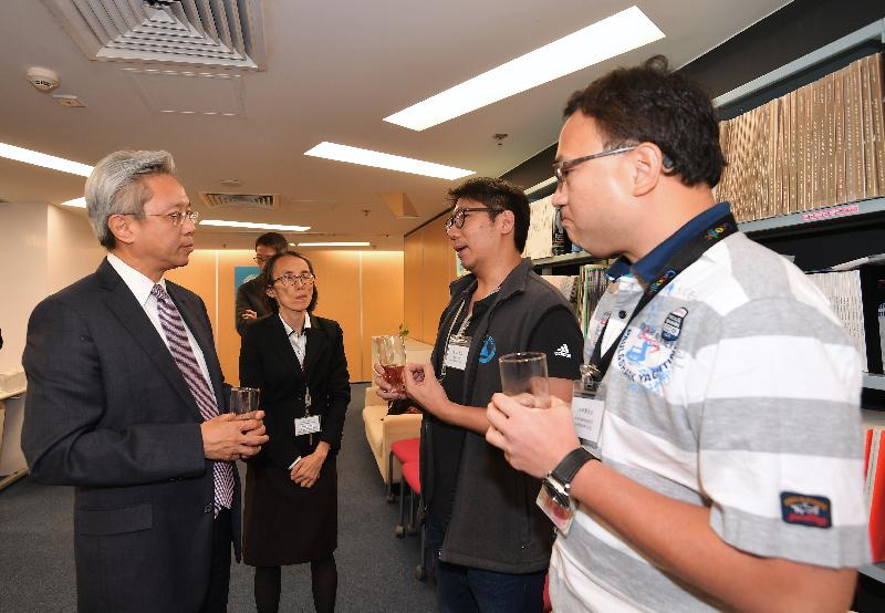 The Secretary for the Civil Service, Mr Joshua Law (first left), visited the Government Laboratory today (November 11) and met with staff representatives of various grades at a tea gathering to exchange views on matters of concern. Looking on is the Government Chemist, Dr Della Sin (second left).