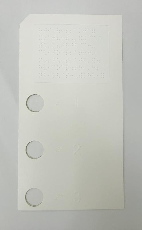 The Registration and Electoral Office today (November 18) made a statement to clarify online rumours about the design of ballot papers. Picture shows a braille ballot paper template with a mock ballot paper inserted. Electors with visual impairments can mark the ballot papers inserted through the holes on the braille ballot paper template. 