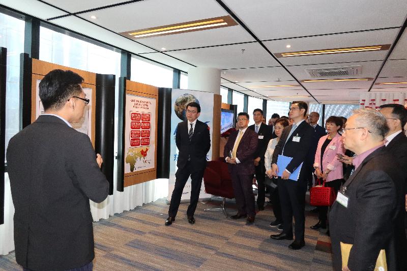 The Secretary for Commerce and Economic Development, Mr Edward Yau, led a delegation comprising business people, professionals and start-up representatives to visit Kuala Lumpur, Malaysia, today (November 26). Photo shows Mr Yau (second left) and the delegates being briefed by the representative of the Malaysia-China Kuantan Industrial Park on the park's latest developments.