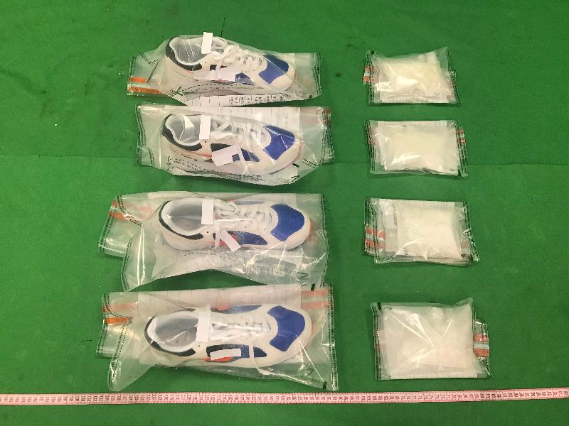 Hong Kong Customs seized about 520 grams of suspected ketamine and about 1 kilogram of suspected cocaine at Hong Kong International Airport on November 22 and 23 respectively with a total estimated market value of about $1.6 million. Photo shows the suspected ketamine seized and the two pairs of sports shoes used to conceal the dangerous drugs.