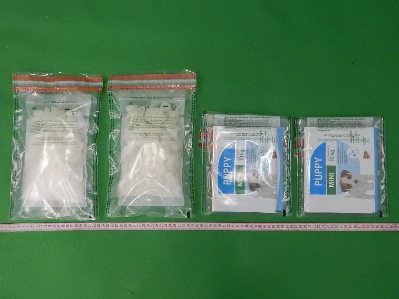 Hong Kong Customs seized a total of about 4 kilograms of suspected ketamine with an estimated market value of about $2.7 million at Hong Kong International Airport on November 28. Photo shows some of the seized suspected ketamine concealed inside two packets of dog food.