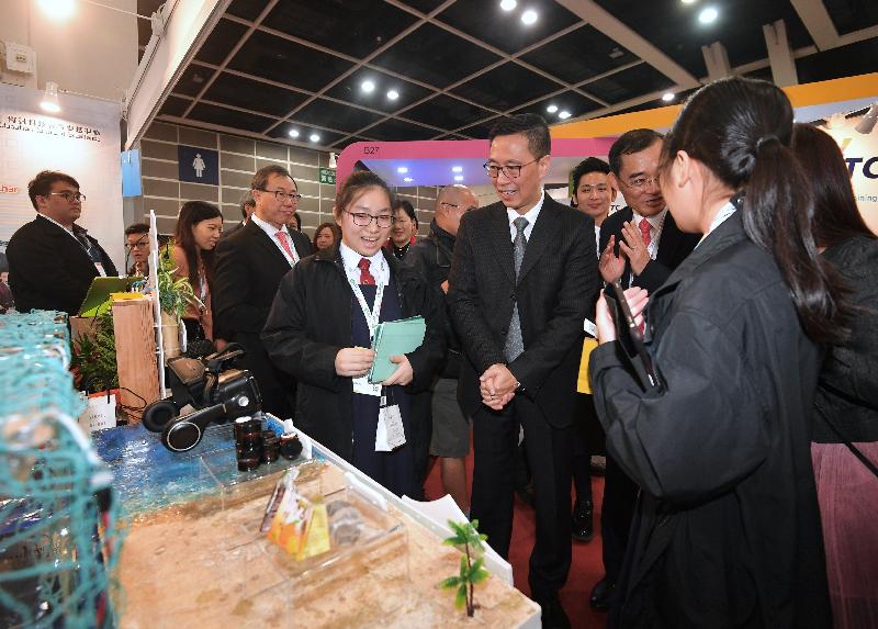 The Secretary for Education, Mr Kevin Yeung (front row, second left), tours the Learning and Teaching Expo 2019 today (December 11).