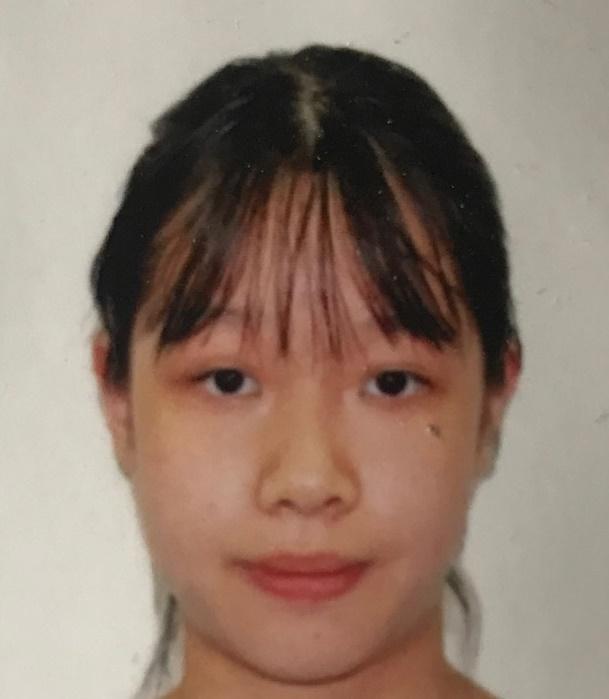 Chong Man-ki, aged 12, is about 1.55 metres tall, 41 kilograms in weight and of medium build. She has a long face with yellow complexion and long black hair. She was last seen wearing a blue and grey school uniform, a blue coat, white socks and black shoes.