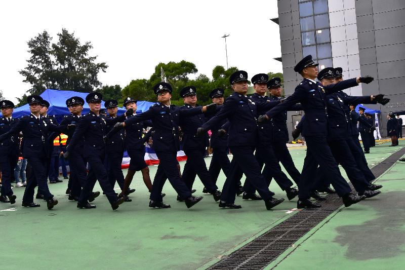 The Civil Aid Service held the 80th Recruits Passing-out Parade at its headquarters today (December 15). Photo shows the parade marching past the review stand.
