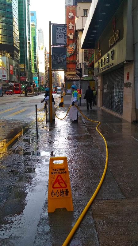 Picture shows cleansing workers of Food and Environmental Hygiene Department contractors provide street cleansing services in Mong Kok this morning (December 16) after large-scale public event there.