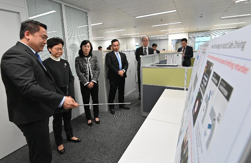 The Chief Executive, Mrs Carrie Lam, visited the Electrical and Mechanical Services Department (EMSD) and the Transport Department today (December 30) to learn more about the measures and recovery work taken by the two departments in response to the protests and vandalistic acts in recent months. Photo shows Mrs Lam (second left) receiving a briefing by Assistant Commissioner for Transport (Bus and Railway), Mr Patrick Wong, (first left) on measures to enhance franchised bus safety.
