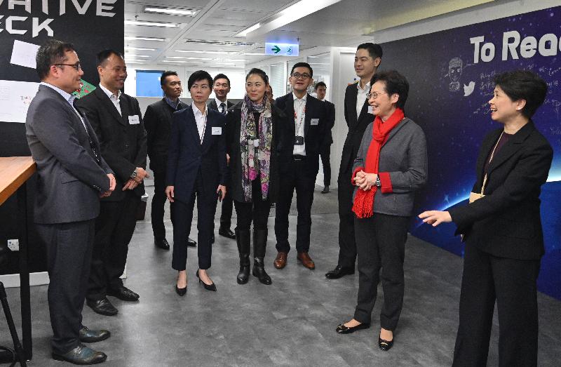 The Chief Executive, Mrs Carrie Lam, today (December 31) visited the Police Headquarters in Wan Chai. Photo shows Mrs Lam (second right), accompanied by the acting Deputy Commissioner of Police (Management), Ms Edwina Lau (first right), visiting Police Public Relations Branch.