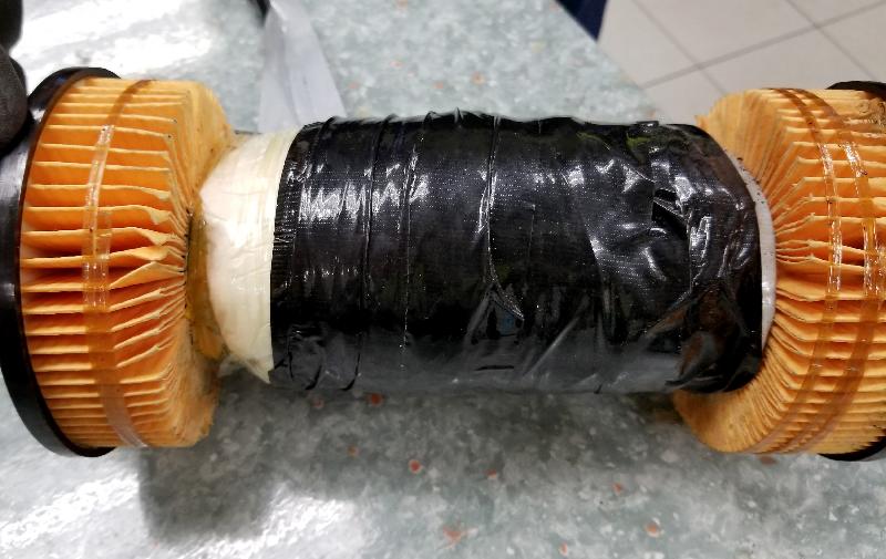 In the light of local demands for drugs during the long holidays, Hong Kong Customs mounted a special operation codenamed "Wave" from October 23 to December 31 last year to fight against drug trafficking activities involving cross-boundary express parcels. Seizures of different kinds of dangerous drugs worth about $39 million were made. Photo shows some of the suspected cocaine concealed inside an oil filter.