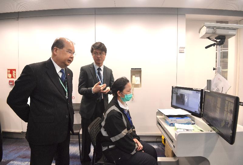 The Chief Secretary for Administration, Mr Matthew Cheung Kin-chung, today (January 8) visited Hong Kong International Airport to inspect the prevention and control measures adopted in response to the cluster of pneumonia cases detected in Wuhan, Hubei Province. Photo shows Mr Cheung (first left) receiving a briefing from the Chief Port Health Officer of the Centre for Health Protection of the Department of Health, Dr Leung Yiu-hong (second left), on the related measures.