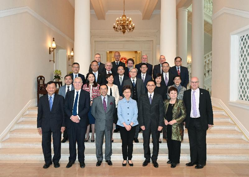 The Chief Executive, Mrs Carrie Lam (first row, centre); the Secretary for Education, Mr Kevin Yeung (first row, third right); the Chairman of the University Grants Committee (UGC), Mr Carlson Tong (first row, third left); and members of the UGC are pictured at Government House today (January 10).