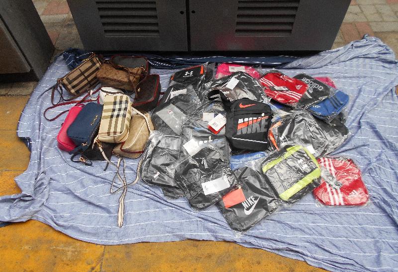 Hong Kong Customs conducted operations against the sale of infringing goods at mobile hawker stalls in Central district for three consecutive Sundays on January 5, on January 12 and yesterday (January 19). During the operations, about 2 200 items of suspected infringing goods with an estimated market value of about $310,000 were seized. Photo shows some of the suspected infringing goods seized.