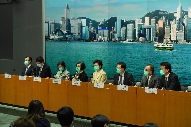 The Chief Executive, Mrs Carrie Lam (fourth right), holds a press conference on measures to fight disease with the Secretary for Commerce and Economic Development, Mr Edward Yau (first right); the Secretary for Constitutional and Mainland Affairs, Mr Patrick Nip (first left); the Secretary for Security, Mr John Lee (third right); the Secretary for Food and Health, Professor Sophia Chan (fourth left); the Director of Immigration, Mr Tsang Kwok-wai (second right); the Director of Health, Dr Constance Chan (third left); and the Chief Executive of the Hospital Authority, Dr Tony Ko (second left), at the Central Government Offices, Tamar, today (January 31).