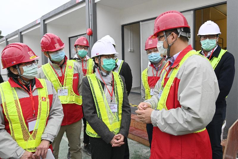 The Chief Executive, Mrs Carrie Lam (fourth left), visited the Lei Yue Mun Park and Holiday Village to inspect the construction progress of new mobile quarantine units of modular housing at the existing site of the park on February 11.
