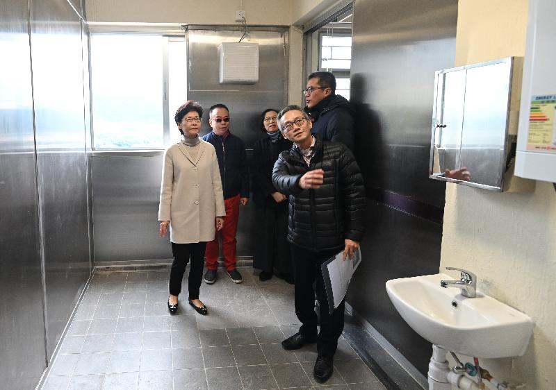 The Chief Executive, Mrs Carrie Lam (first left) today (February 16) inspected anti-epidemic work at various locations to know more about the work situation of front-line personnel and express gratitude to them for standing fast at their posts during the epidemic to help Hong Kong fight the disease. Photo shows Mrs Lam accompanied by the Secretary for Food and Health, Professor Sophia Chan (third left) and the Secretary for Development, Mr Michael Wong (first right), receiving a briefing by a member of the Architectural Services Department on the works progress of the conversion of some facilities of the Junior Police Call activity centre at Pat Heung into a quarantine centre.