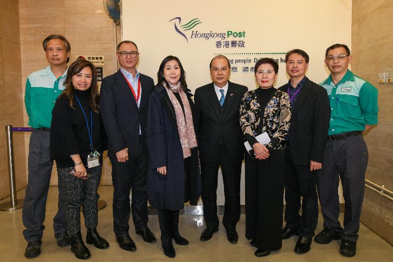 The Chief Secretary for Administration, Mr Matthew Cheung Kin-chung (fourth right), accompanied by the Postmaster General, Miss Cathy Chu (fourth left), and the Deputy Postmaster General, Ms Teresa Au (third right), today (February 17) visits Hongkong Post for an update on its handling of surgical mask items.