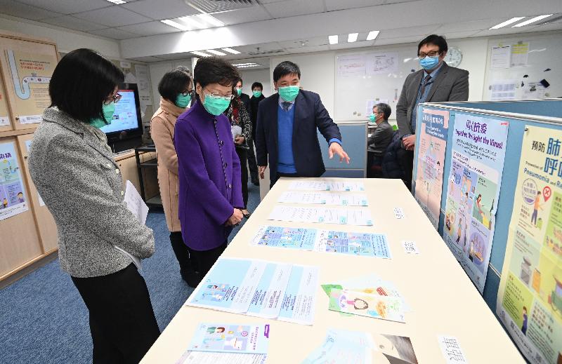 The Chief Executive, Mrs Carrie Lam, visited the Centre for Health Protection of the Department of Health this afternoon (February 19) to thank the staff members for their hard work in tackling the infection day and night. Photo shows Mrs Lam (third left) viewing multilingual health information.