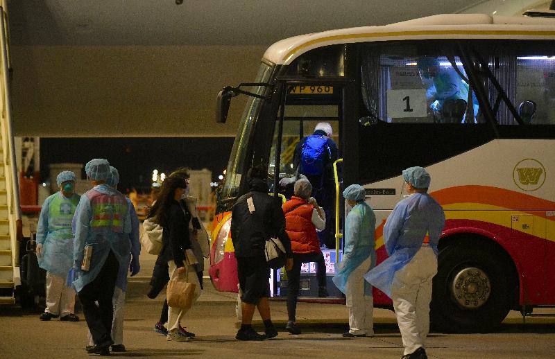 The third chartered flight arranged by the Hong Kong Special Administrative Region Government to bring back the Hong Kong residents on board the Diamond Princess cruise arrived Hong Kong this morning (February 23). Picture shows Hong Kong residents who alighted from the chartered flight boarding a coach.