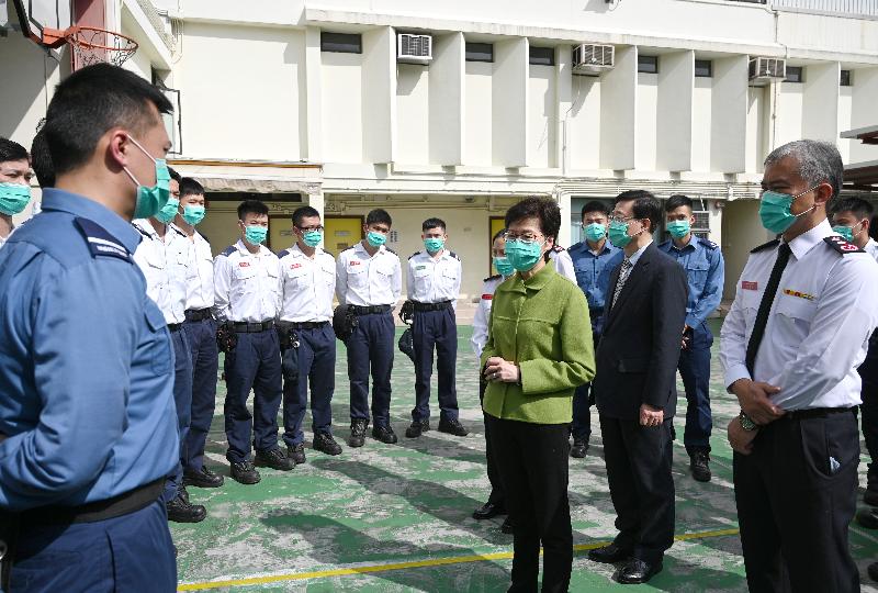 The Chief Executive, Mrs Carrie Lam, visited Lei Muk Shue Fire Station cum Ambulance Depot in Kwai Chung today (February 28), expressing her gratitude to firemen and ambulancemen for fighting the infection at the forefront, providing emergency services to the public day and night. Photo shows Mrs Lam (front row, third right), accompanied by the Secretary for Security, Mr John Lee (front row, second right), and the Director of Fire Services, Mr Li Kin-yat (front row, first right), learning about the work situation of frontline ambulancemen and firemen.