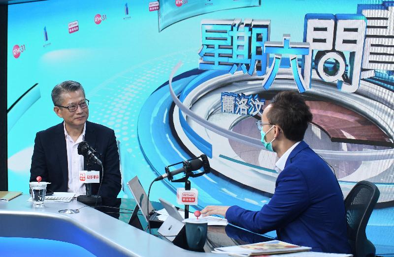 The Financial Secretary, Mr Paul Chan (left), attends Radio Television Hong Kong's programme "Accountability" this morning (February 29) to answer questions on the 2020-21 Budget.