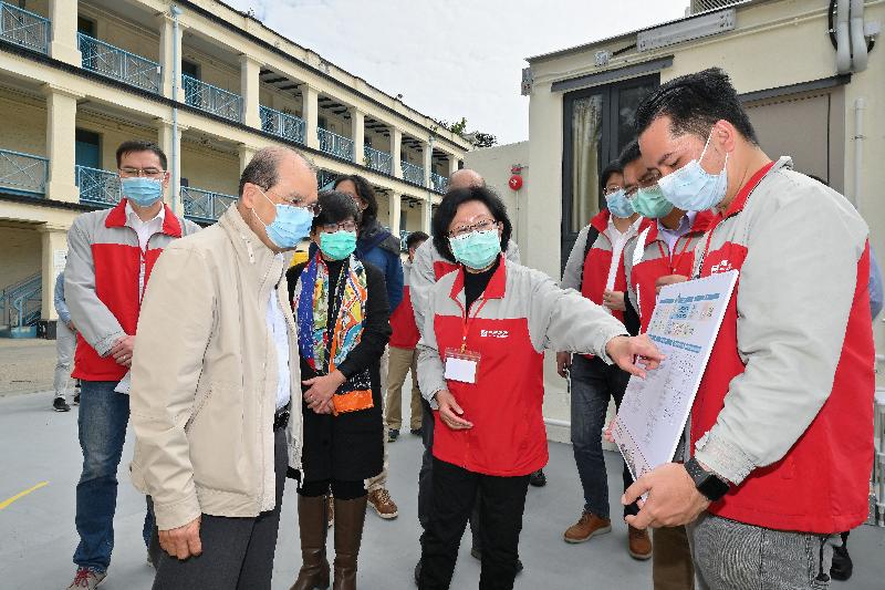 The Chief Secretary for Administration and Chairman of the Anti-epidemic Fund Steering Committee, Mr Matthew Cheung Kin-chung, today (February 29) visited Lei Yue Mun Park and Holiday Village to inspect the newly developed temporary quarantine facilities that will soon commence operation. Photo shows Mr Cheung (front row, first left), accompanied by the Director of Architectural Services, Mrs Sylvia Lam (front row, second left), receiving a briefing from a representative of the contractor on the health and safety measures to protect on-site workers.
