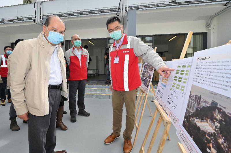 The Chief Secretary for Administration and Chairman of the Anti-epidemic Fund Steering Committee, Mr Matthew Cheung Kin-chung, today (February 29) visited Lei Yue Mun Park and Holiday Village to inspect the newly developed temporary quarantine facilities that will soon commence operation. Photo shows Mr Cheung (front row, first left), receiving a briefing from a representative of the contractor on the development process of the temporary quarantine facilities and how the construction team overcame challenges.