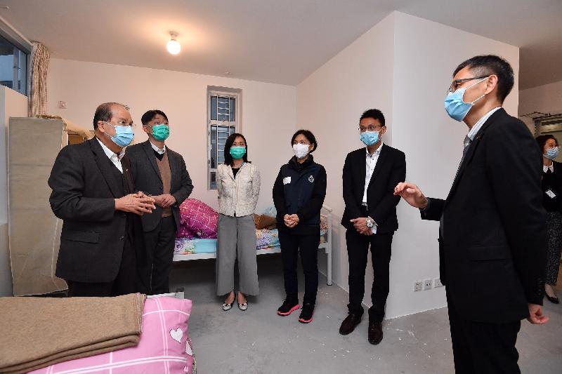 The Chief Secretary for Administration, Mr Matthew Cheung Kin-chung, today (March 2) visited the quarantine centre at Chun Yeung Estate to observe its operation and inspected the quarantine preparatory arrangements for Hong Kong residents returning to Hong Kong from Wuhan soon. Photo shows Mr Cheung (first left), accompanied by the Deputy Secretary for Food and Health (Food), Mr Daniel Cheng (second left), receiving a briefing on the quarantine preparatory arrangements from the Chief Staff Officer of the Civil Aid Service, Mr Francis Fong (first right), at Block Two of Chun Yeung Estate.