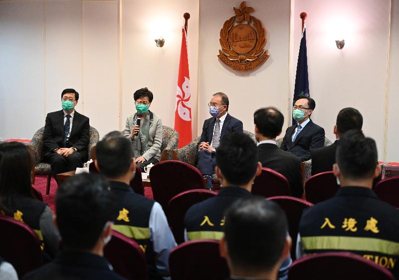 The Chief Executive, Mrs Carrie Lam, visited the office of the Assistance to Hong Kong Residents Unit of the Immigration Department (ImmD) in Wan Chai this afternoon (March 2), expressing her gratitude to personnel of the ImmD for standing fast at their posts during the epidemic. Photo shows Mrs Lam (second left), accompanied by the Secretary for Security, Mr John Lee (first left); the Secretary for Constitutional and Mainland Affairs, Mr Patrick Nip (first right) and the Director of Immigration, Mr Erick Tsang (second right), giving remarks to encourage the Immigration officers.