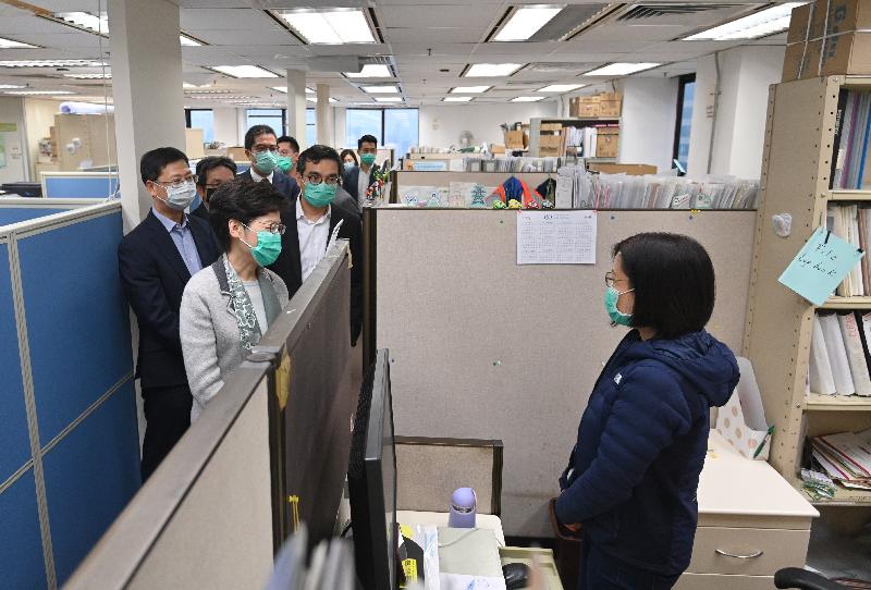 After visiting the Immigration Department in Wan Chai this afternoon (March 2), the Chief Executive, Mrs Carrie Lam proceeded to the Water Supplies Department (WSD) to learn about the situation of the resumption of work of colleagues. Photo shows Mrs Lam (second left), accompanied by the Director of Water Supplies, Mr Wong Chung-leung (first left), chatting with a WSD officer.