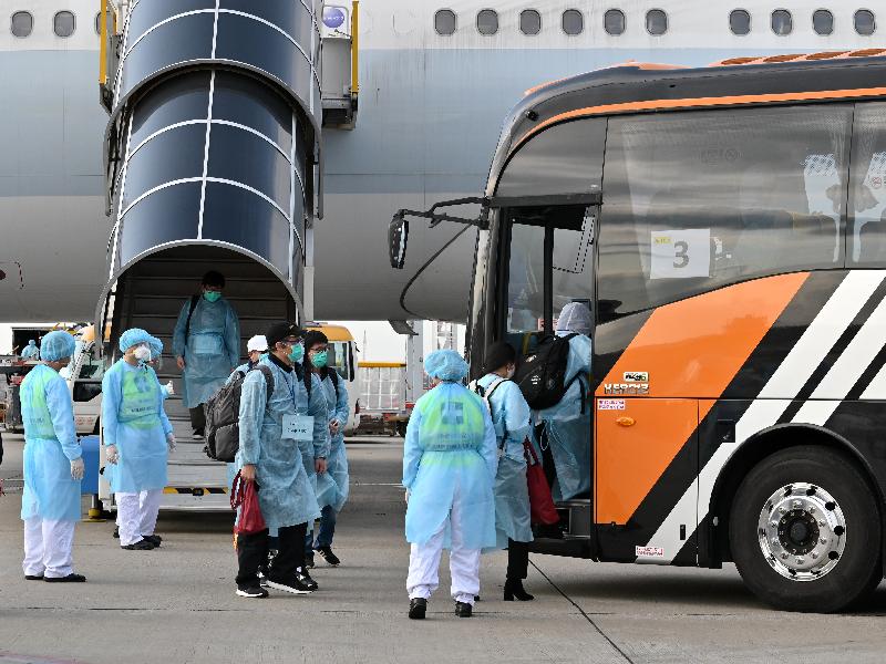 Hong Kong residents stranded in Hubei Province were safely brought back to Hong Kong by the chartered flight arranged by the Hong Kong Special Administrative Region Government today (March 5). Photo shows them boarding a coach to depart for the quarantine facility.