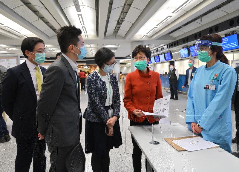 The Chief Executive, Mrs Carrie Lam (second right), accompanied by the Secretary for Food and Health, Professor Sophia Chan (third right) and the Chief Executive Officer of the Airport Authority Hong Kong, Mr Fred Lam (first left), visited the Hong Kong International Airport this afternoon (March 19) to inspect the implementation of compulsory quarantine measures on all persons arriving from overseas countries and territories starting from 0.00am today. 