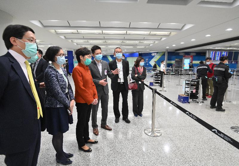 The Chief Executive, Mrs Carrie Lam (third left), accompanied by the Secretary for Food and Health, Professor Sophia Chan (second left) and the Chief Executive Officer of the Airport Authority Hong Kong, Mr Fred Lam (first left), visited the Hong Kong International Airport this afternoon (March 19) to inspect the implementation of compulsory quarantine measures on all persons arriving from overseas countries and territories starting from 0.00am today.