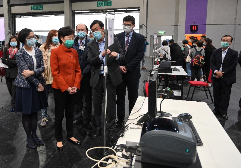 The Chief Executive, Mrs Carrie Lam (second left), accompanied by the Secretary for Food and Health, Professor Sophia Chan (first left) and the Chief Executive Officer of the Hospital Authority (HA), Dr Tony Ko (fourth left), visited the AsiaWorld-Expo this afternoon (March 19) to learn about the preparation work of the HA to set up a test centre there.
