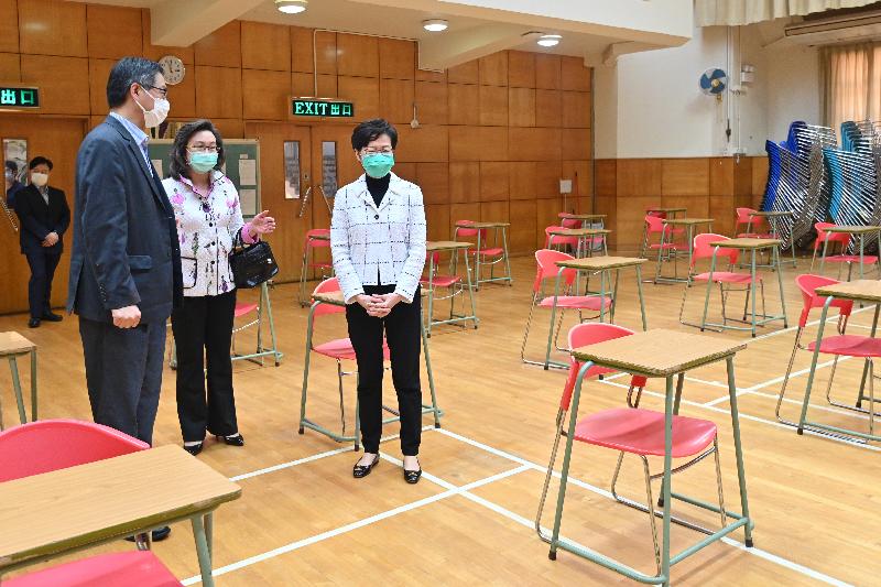 The Chief Executive, Mrs Carrie Lam, visited Yan Chai Hospital Wong Wha San Secondary School in Tseung Kwan O today (March 23) to know about e-learning arranged by teachers for students during class suspension. She also thanked the teaching staff for supporting students to continue learning at home. Photo shows Mrs Lam (right) visiting the school hall which will be used for the Hong Kong Diploma of Secondary Education Examination.