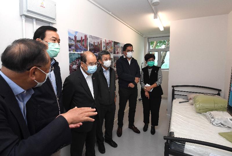 The Chief Secretary for Administration, Mr Matthew Cheung Kin-chung, today (April 23) visited the Junior Police Call Permanent Activity Centre at Pat Heung, Yuen Long, to inspect the newly developed quarantine units that will soon commence operation. Photo shows Mr Cheung (third left), accompanied by the Secretary for Development, Mr Michael Wong (second right), and the Director of Architectural Services, Mrs Sylvia Lam (first right), touring one of the new quarantine units. 