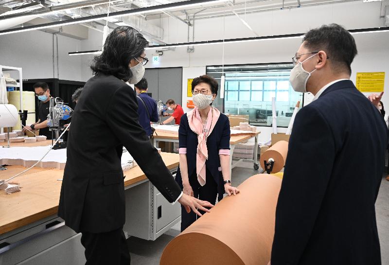The Chief Executive, Mrs Carrie Lam (centre), this morning (May 6) inspected one of the production sites of CuMask+™ in Tsuen Wan. Photo shows Mrs Lam being briefed by the Chief Executive Officer of the Hong Kong Research Institute of Textiles and Apparel, Mr Edwin Keh (left), on the production of the reusable CuMask+™. Looking on is the Secretary for Innovation and Technology, Mr Alfred Sit (right).