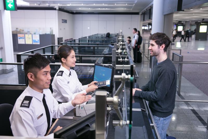 The Hong Kong Immigration Department (ImmD) has been voted the winner of the 2020 best airport immigration service award in the World Passenger Survey commissioned by Skytrax, an international specialist research agent of the air transport industry. Photo shows staff of the ImmD providing professional and quality immigration services for air passengers at Hong Kong International Airport.