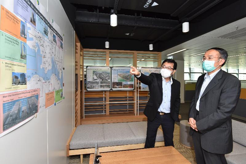 The Secretary for Financial Services and the Treasury, Mr Christopher Hui, visited the Government Property Agency today (May 19). Photo shows Mr Hui (first right) being briefed on the progress of the relocation of the Wan Chai Government Offices Compound.