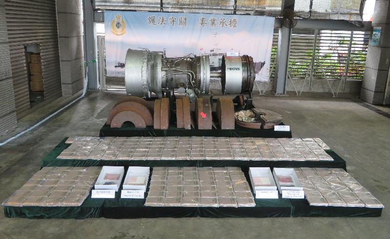 Hong Kong Customs seized about 217 kilograms of suspected cocaine with an estimated market value of about $246 million from a seaborne container at the Kwai Chung Customhouse Cargo Examination Compound on May 20. This is the first drug trafficking case making use of an aircraft engine uncovered by Customs. The amount of cocaine seized in the case is a record high for a seaborne case since 2012. Photo shows the aircraft engine suspected to be involved in the case and the suspected cocaine seized.