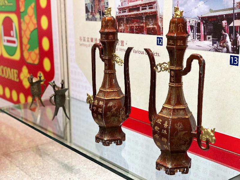 The exhibition "Folk Festivals in Those Days …" by the Public Records Office opens from today (June 12), showcasing festivals celebrated past and present through archival holdings. Photo shows a pair of tin flagons contributed by the Tung Tau Estate Yu Lan Sing Association Limited, having been used for offerings to the deities in the Yu Lan Ghost Festival. This pair of flagons, still being used today, were donated by the Hong Kong famous tinware craftsmen Chaoyang Yan clan in the 1960s. Tinware has become uncommon nowadays, rendering this pair of flagons relatively rare. 
