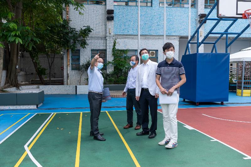 Members of the Legislative Council visited Rhenish Church Grace School today (June 19) to follow up on a complaint relating to the conversion works of the School. Photo shows Members Dr Cheng Chung-tai (first right), Mr Ip Kin-yuen (second right) and Dr Fernando Cheung (second left) observing the playground of the School.