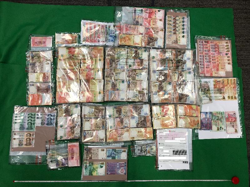 Hong Kong Customs seized about 1.6 kilograms of suspected ketamine and about 300 grams of suspected crack cocaine with an estimated market value of about $1.3 million during an anti-narcotics operation conducted in Lai Chi Kok on June 26. Customs officers also seized about $7.8 million of suspected drug trafficking proceeds. Photo shows the suspected drug trafficking proceeds including cash and a cashier's order.