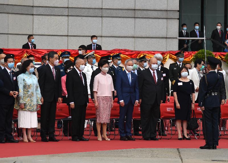 The Chief Executive, Mrs Carrie Lam (front row, fifth left), and her husband Dr Lam Siu-por (front row, sixth left); the Chief Justice of the Court of Final Appeal, Mr Geoffrey Ma Tao-li (front row, seventh left) and his wife, Madam Justice Maria Candace Yuen (front row, eighth left); Vice-Chairman of the National Committee of the Chinese People's Political Consultative Conference (CPPCC) Mr Tung Chee Hwa (front row, fourth left); Vice-Chairman of the National Committee of the CPPCC Mr C Y Leung (front row, third left) and his wife, Mrs Regina Leung (front row, second left); the Director of the Liaison Office of the Central People's Government in the Hong Kong Special Administrative Region (HKSAR), Mr Luo Huining (front row, first left), together with Principal Officials and guests, attend the flag-raising ceremony for the 23rd anniversary of the establishment of the Hong Kong Special Administrative Region at Golden Bauhinia Square in Wan Chai this morning (July 1).