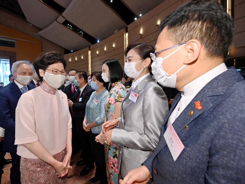 The Chief Executive, Mrs Carrie Lam, together with Principal Officials and guests, attended the reception for the 23rd anniversary of the establishment of the Hong Kong Special Administrative Region at the Hong Kong Convention and Exhibition Centre this morning (July 1). Photo shows Mrs Lam (second left) chatting with guests.