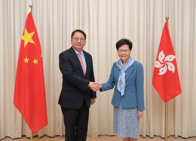 The Chief Executive, Mrs Carrie Lam (right), poses with the Secretary General of the Committee for Safeguarding National Security of the Hong Kong Special Administrative Region, Mr Chan Kwok-ki (left), today (July 2).