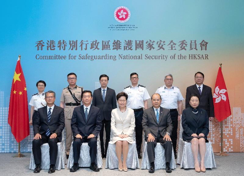 The Committee for Safeguarding National Security of the Hong Kong Special Administrative Region today (July 6) convened its first meeting, which was attended by all its members. The National Security Adviser appointed by the Central People's Government also sat in on the meeting. A group photo was taken before the meeting. In the first row are the Committee Chairman, the Chief Executive, Mrs Carrie Lam (centre); the National Security Adviser, Mr Luo Huining (second left); the Chief Secretary for Administration, Mr Matthew Cheung Kin-chung (second right); the Financial Secretary, Mr Paul Chan (first left); and the Secretary for Justice, Ms Teresa Cheng, SC (first right). The members in the second row are (from left) the Deputy Commissioner of Police (National Security), Ms Edwina Lau; the Commissioner of Customs and Excise, Mr Hermes Tang; the Secretary for Security, Mr John Lee; the Commissioner of Police, Mr Tang Ping-keung; the Director of Immigration, Mr Au Ka-wang; and the Director of the Chief Executive's Office, Mr Chan Kwok-ki.