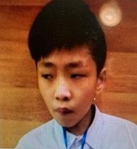 Tam Kin-lok, aged 13, is about 1.5 metres tall, 35 kilograms in weight and of thin build. He has a long face with yellow complexion and short black hair. He was last seen wearing a white school polo shirt, dark blue sports trousers and black shoes.